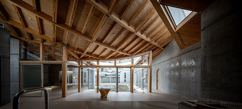 hyperbolic roof composed of curved timber slats tops concrete residence in taiwan