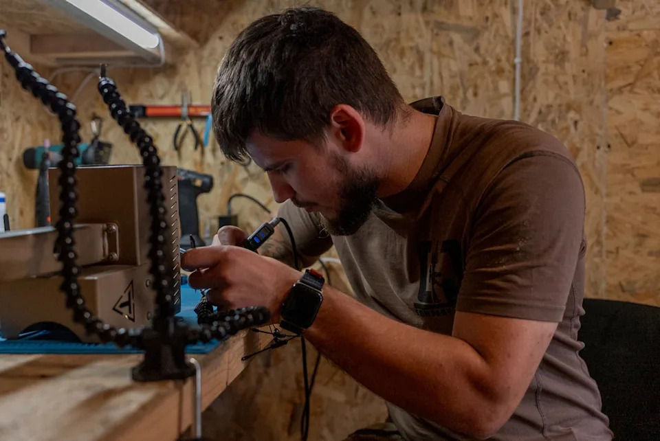 A Ukrainian serviceman known by the call sign ‘Miami’ works on robotic military equipment near the front line in Donetsk region, Ukraine, on Monday, Sept. 8, 2025. (AP Photo/Alex Babenko) (Copyright 2025 The Associated Press. All rights reserved.)