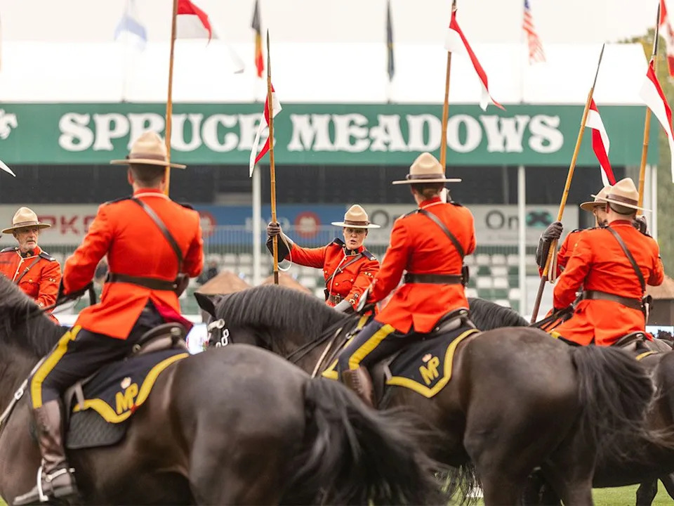  Mounties perform on horseback in the RCMP Musical Ride during the Spruce Meadows Masters near Calgary on Wednesday, Sept. 3, 2025.