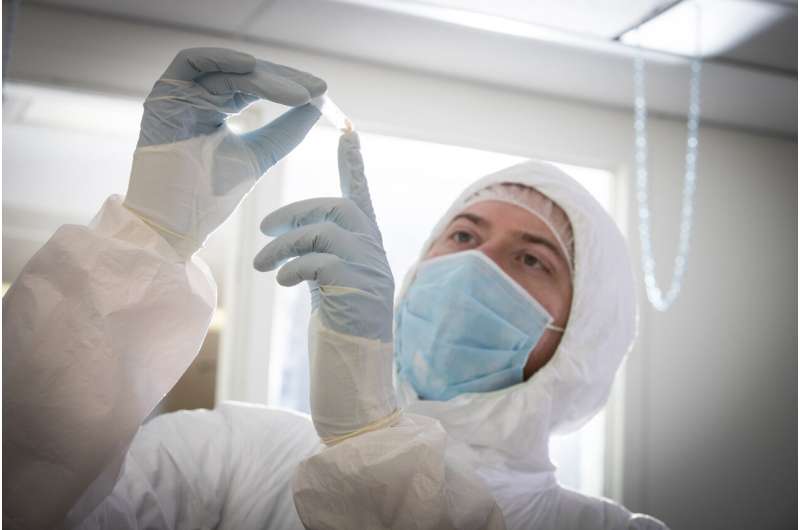 Study co-author Emil Karpinski examining ancient bone in McMaster's Ancient DNA lab. Credit: McMaster University Ancient DNA reveals deeply complex Mastodon family and repeated migrations driven by climate change