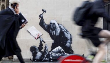 Banksy mural of judge beating protester is scrubbed from London court