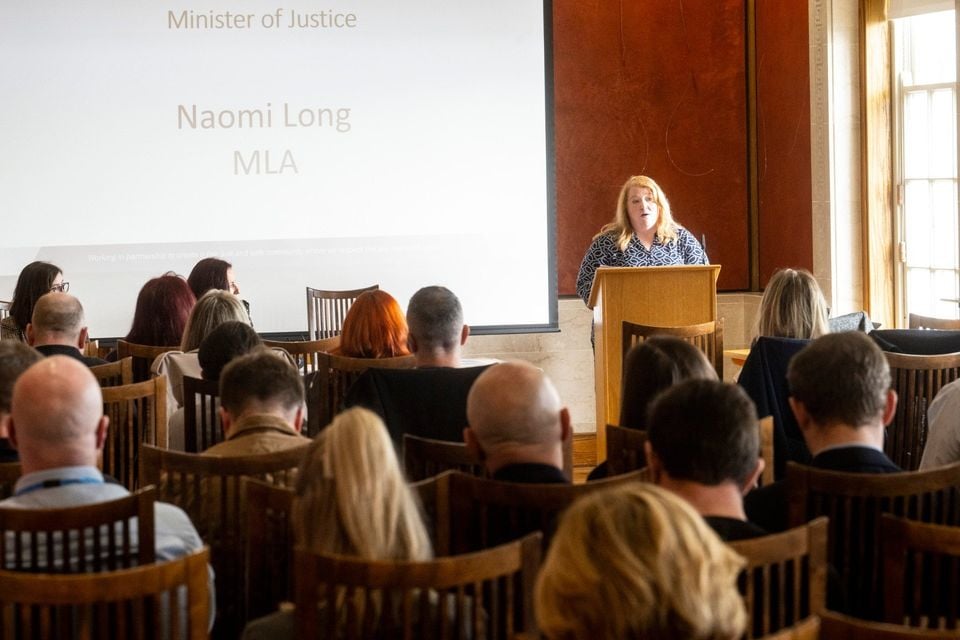 Justice Minister Naomi Long speaking at the launch of the research study in the Long Gallery, Parliament Buildings.