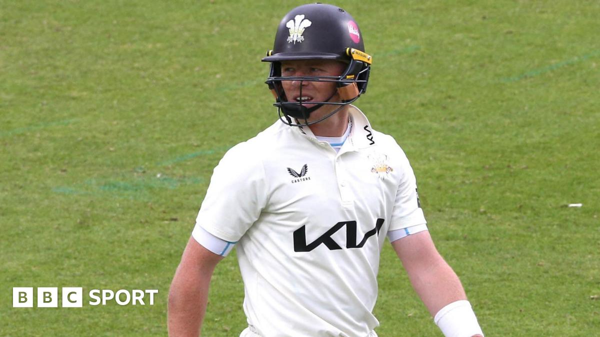 Ollie Pope walks off the field