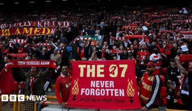 Liverpool's supporters hold banners reading messages paying a tribute to the victims of the Hillsborough disaster at the start of the English Premier League football match between Liverpool and West Ham United at Anfield in Liverpool, north west England on April 13, 2025.