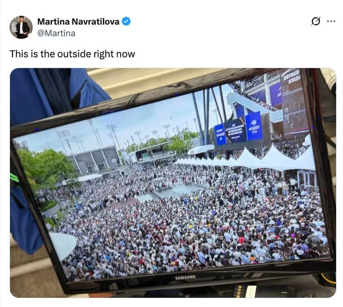 Tweet by Martina Navratilova shows a screen displaying a large crowd gathered at an outdoor event