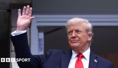 Donald Trump waves to fans at Arthur Ashe Stadium