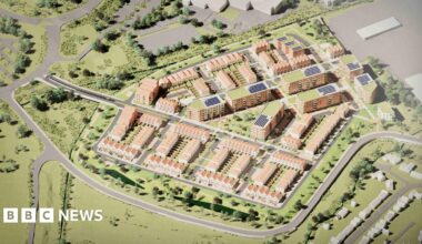 Artist's impression of an aerial shot of a housing development of 400 homes, showing road layouts, grassy areas, trees and pathways