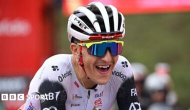 Marc Soler smiles as he crosses the line in first place on stage 14 of the Vuelta a Espana