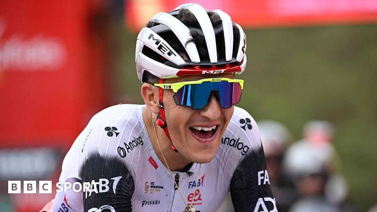 Marc Soler smiles as he crosses the line in first place on stage 14 of the Vuelta a Espana