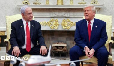 US President Donald Trump talks to Israeli Prime Minister Benjamin Netanyahu during a meeting where Trump announced nuclear talks with Iran