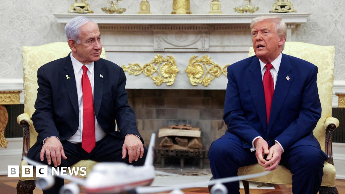 US President Donald Trump talks to Israeli Prime Minister Benjamin Netanyahu during a meeting where Trump announced nuclear talks with Iran