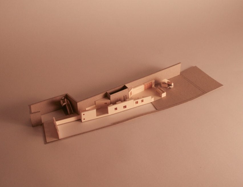 a photograph of an architectural model in tones of brown and beige