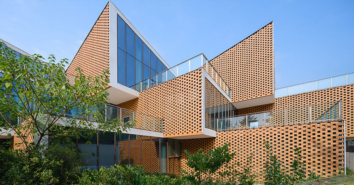 permeable terracotta brick screens wrap kindergarten's stacked volumes by NAN architects