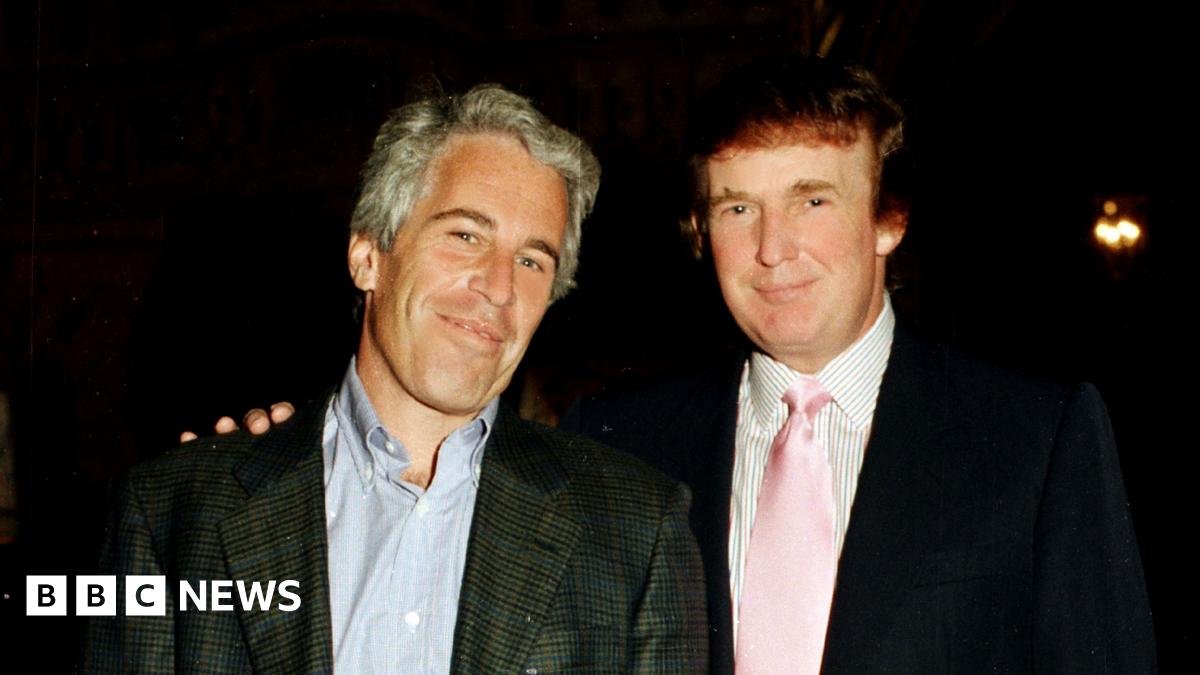 Jeffrey Epstein and Donald Trump pose for a photo together in 1997 with Trump putting his right hand on Epstein's left shoulder.