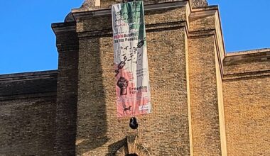 Protester climbs London’s King’s Cross tower with freedom banner for Iran