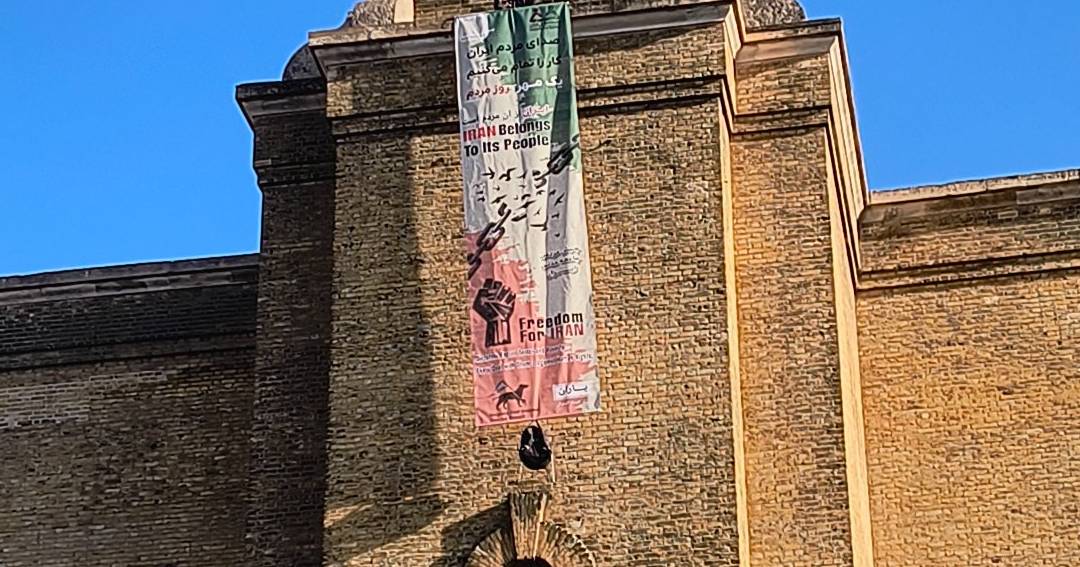 Protester climbs London’s King’s Cross tower with freedom banner for Iran