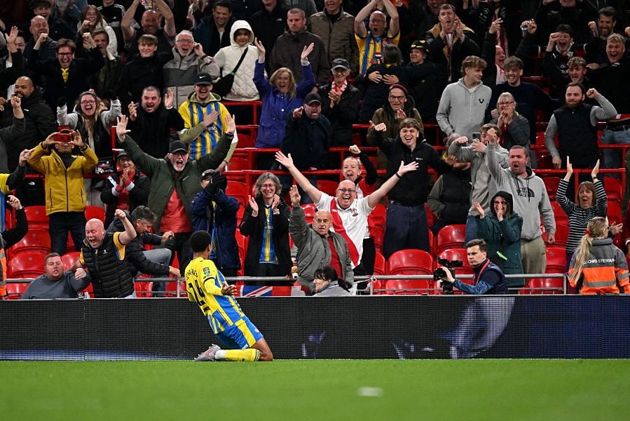 Shea Charles celebrates in front of the Southampton fans after finding the net against Liverpool