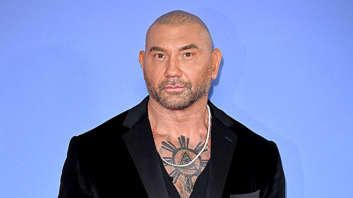 Dave Bautista posing at London premiere of "Glass Onion" in 2022