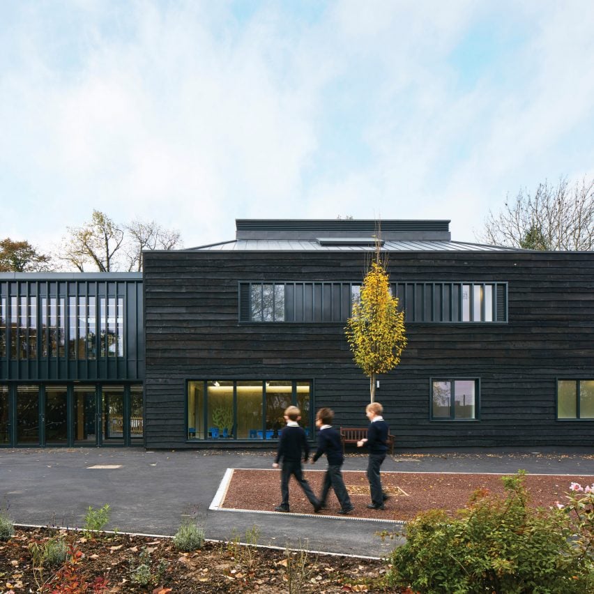 Rough-sawn timber facade of British school