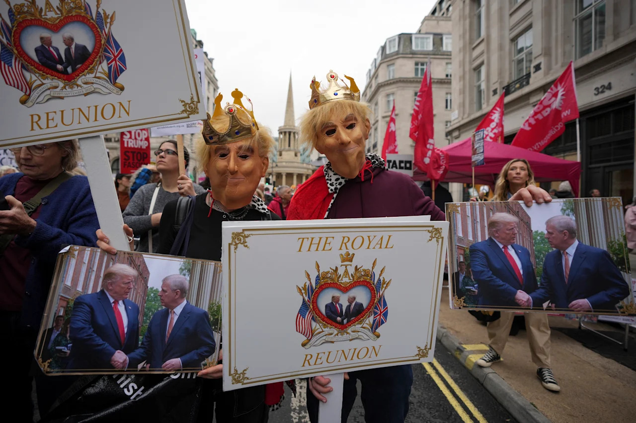 Protesters wear royal costumes during a demonstration of the Stop Trump Coalition group.