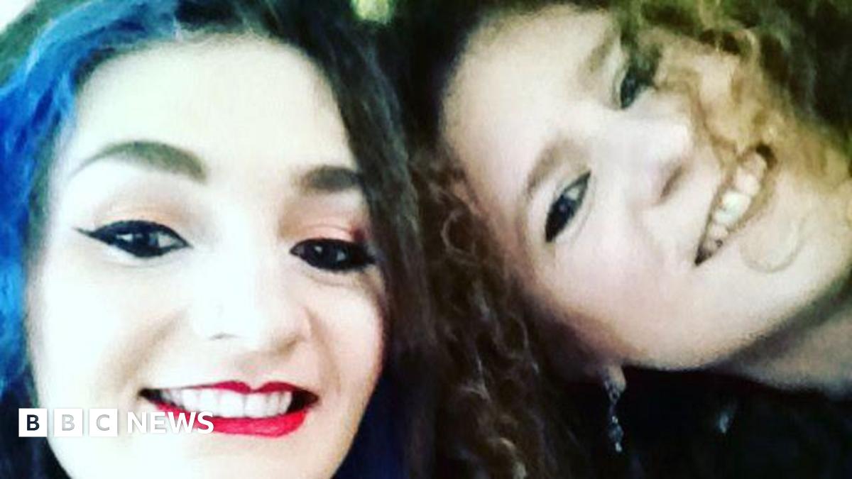 A close up shot of two women smiling
