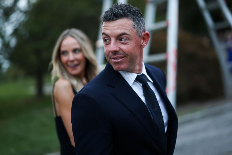 Rory McIlroy of Team Europe and wife Erica Stoll McIlroy arrive for the Ryder Cup Teams' Welcome Dinner prior to the Ryder Cup 2025 at Hempstead House on September 23, 2025 in Sands Point, New York. (Photo by Carl Recine/Getty Images)