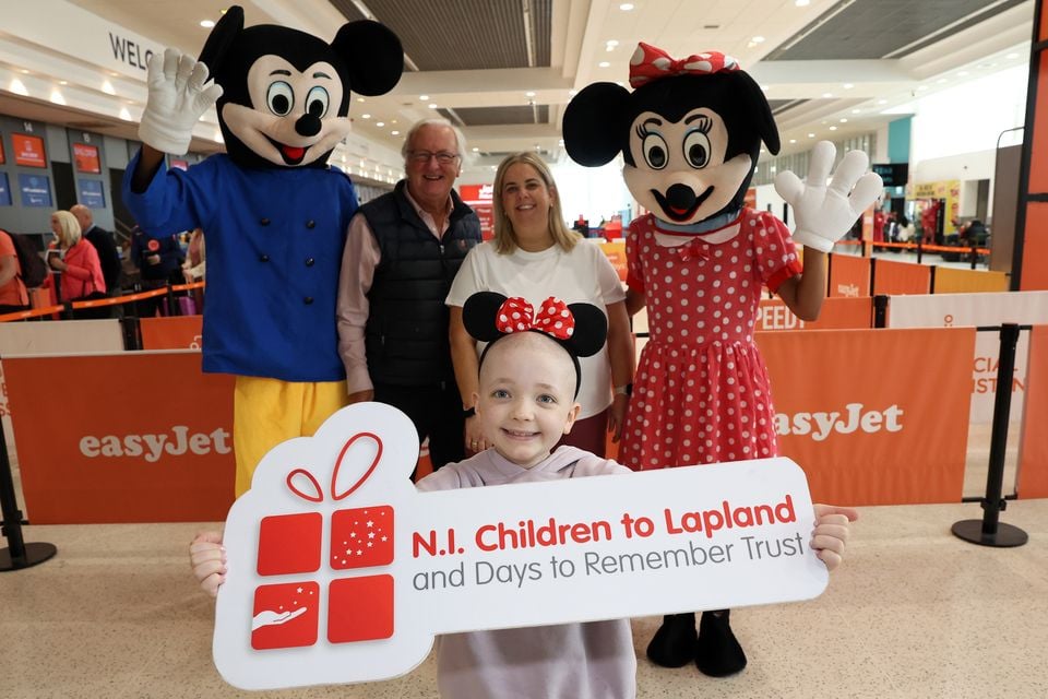 Faye McEvoy (10) from Co Tyrone with Colin Barkley, Chair, Northern Ireland Children to Lapland and Days to Remember Trust and mum Nuala McEvoy
