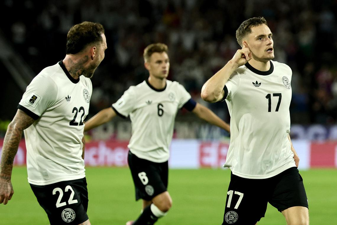 Germany's Florian Wirtz (right) celebrates with teammates after scoring their third goal on Sept 7 against Northern Ireland.