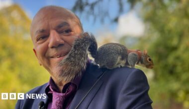 Mehmet Onal with Alvin the squirrel on his shoulder