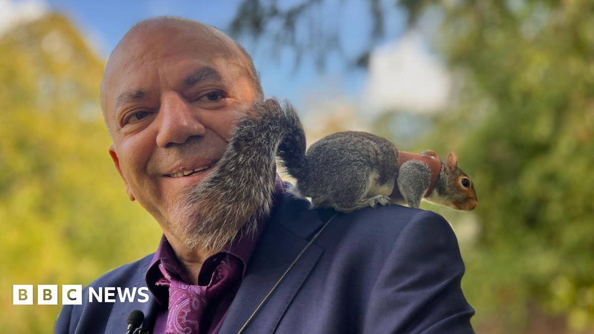 Mehmet Onal with Alvin the squirrel on his shoulder