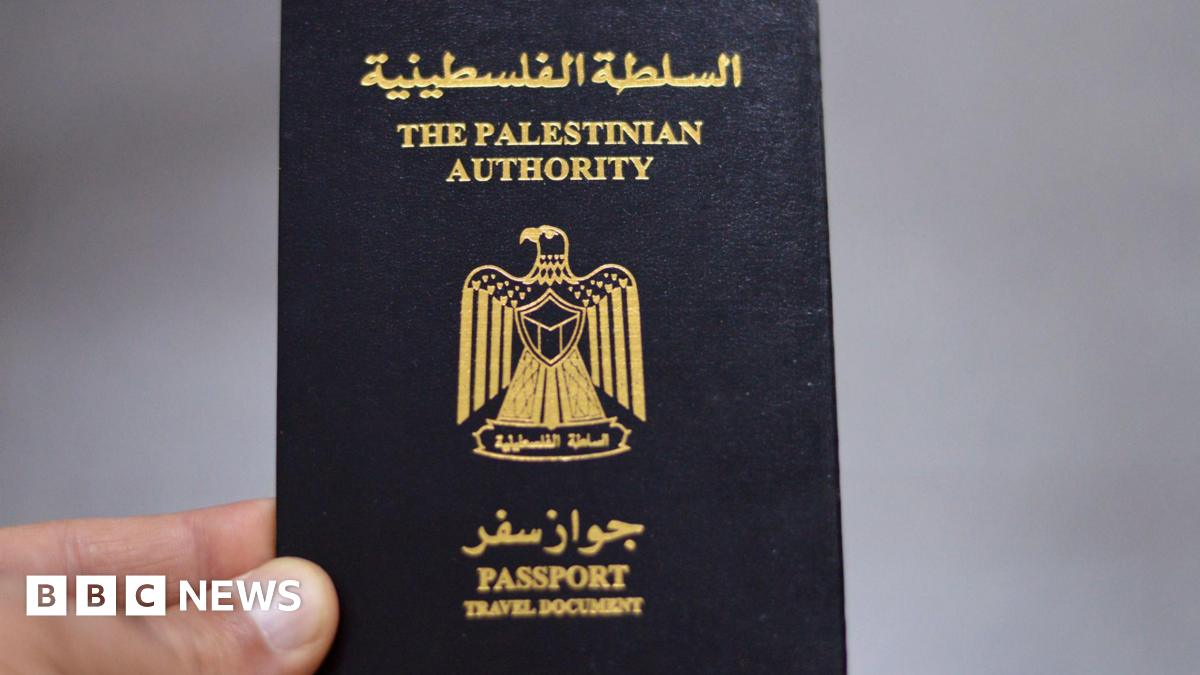 File image of a hand holding a passport issued by the Palestinian Authority