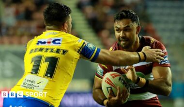 Wigan's Bevan French looks to fend off a tackle against Leeds
