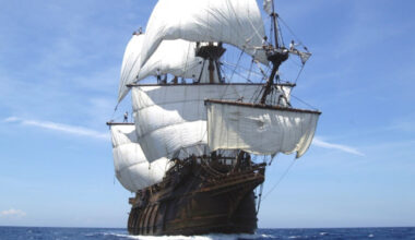 A full-size replica of a seventeenth-century Spanish galleon sailing on the sea on a sunny day