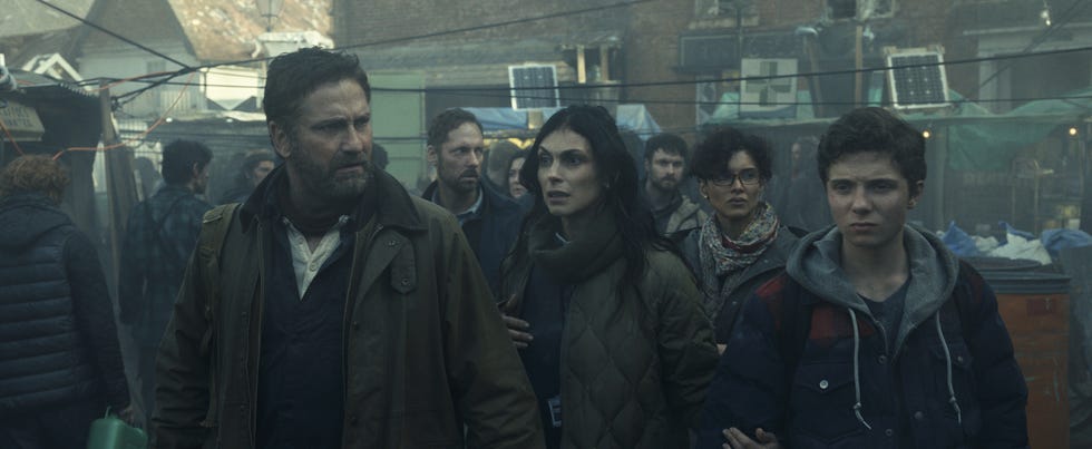 Gerard Butler as John Garrity, Morena Baccarin as Allison Garrity, Amber Rose Revah as Dr. Casey Amina, and Roman Griffin Davis as Nathan Garrity, Greenland 2: Migration gerard butler as john garrity, morena baccarin as allison garrity, amber rose revah as dr casey amina, and roman griffin davis as nathan garrity, greenland 2 migration
