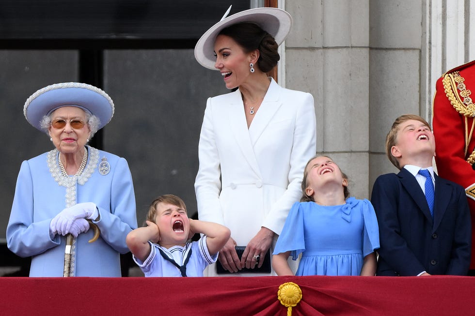 topshot britains prince louis of cambridge (2l) holds his ears as he stands next to britains queen elizabeth ii (l), his m mother britains catherine, duchess of cambridge (c), britains princess charlotte of cambridge (2r)and britains prince george of cambridge to watch a special flypast from buckingham palace balcony following the queens birthday parade, the trooping the colour, as part of queen elizabeth iis platinum jubilee celebrations, in london on june 2, 2022. huge crowds converged on central london in bright sunshine on thursday for the start of four days of public events to mark queen elizabeth iis historic platinum jubilee, in what could be the last major public event of her long reign. (photo by daniel leal / afp) (photo by daniel leal/afp via getty images)