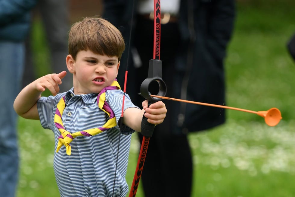 london, england may 08: prince louis of wales tries his hand at archery while taking part in the big help out, during a visit to the 3rd upton scouts hut in slough on may 8, 2023 in london, england. the big help out is a day when people are encouraged to volunteer in their communities. it is part of the celebrations of the coronation of charles iii and his wife, camilla, as king and queen of the united kingdom of great britain and northern ireland, and the other commonwealth realms that took place at westminster abbey on saturday, may 6, 2023. (photo by daniel leal wpa pool/getty images)