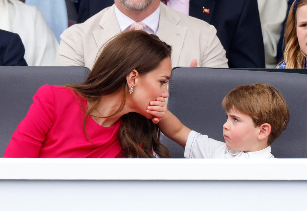 london, united kingdom june 05: (embargoed for publication in uk newspapers until 24 hours after create date and time) prince louis of cambridge covers his mother catherine, duchess of cambridges mouth with his hand as they attend the platinum pageant on the mall on june 5, 2022 in london, england. the platinum jubilee of elizabeth ii is being celebrated from june 2 to june 5, 2022, in the uk and commonwealth to mark the 70th anniversary of the accession of queen elizabeth ii on 6 february 1952. (photo by max mumby/indigo/getty images)