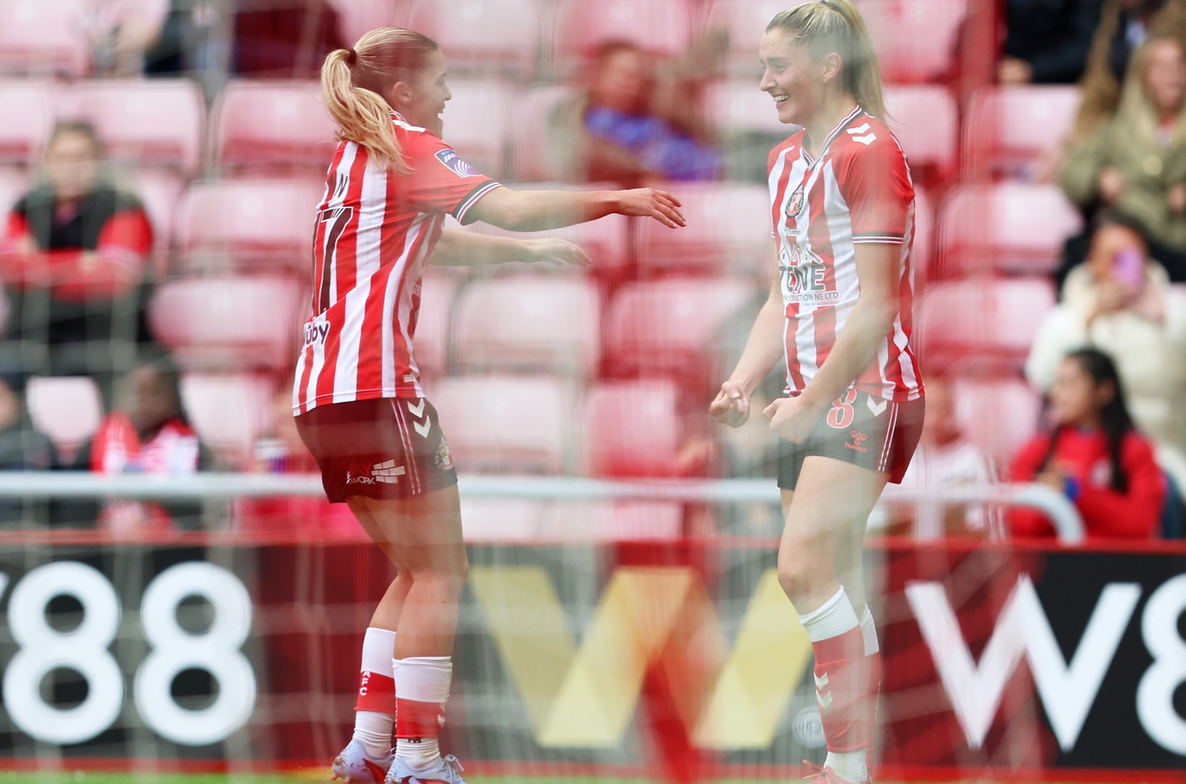 SUNDERLAND, ENGLAND - SEPTEMBER 14: Emily Scarr of Sunderland celebrates scoring her team’s first goal with teammates during the Barclays Women’s Super League 2 match between Sunderland and Birmingham City at Stadium of Light on September 14, 2025 in Sunderland, England. (Photo by Cameron Smith - WSL/WSL Football via Getty Images)