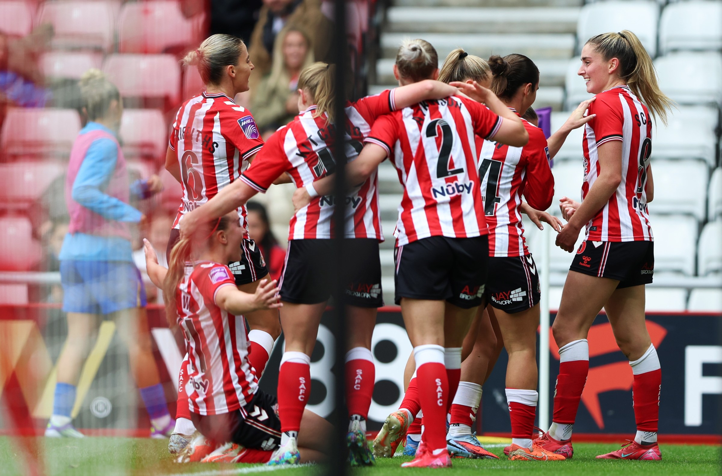 SUNDERLAND, ENGLAND - SEPTEMBER 14: Emily Scarr of Sunderland celebrates scoring her team’s first goal with teammates during the Barclays Women’s Super League 2 match between Sunderland and Birmingham City at Stadium of Light on September 14, 2025 in Sunderland, England. (Photo by Cameron Smith - WSL/WSL Football via Getty Images)