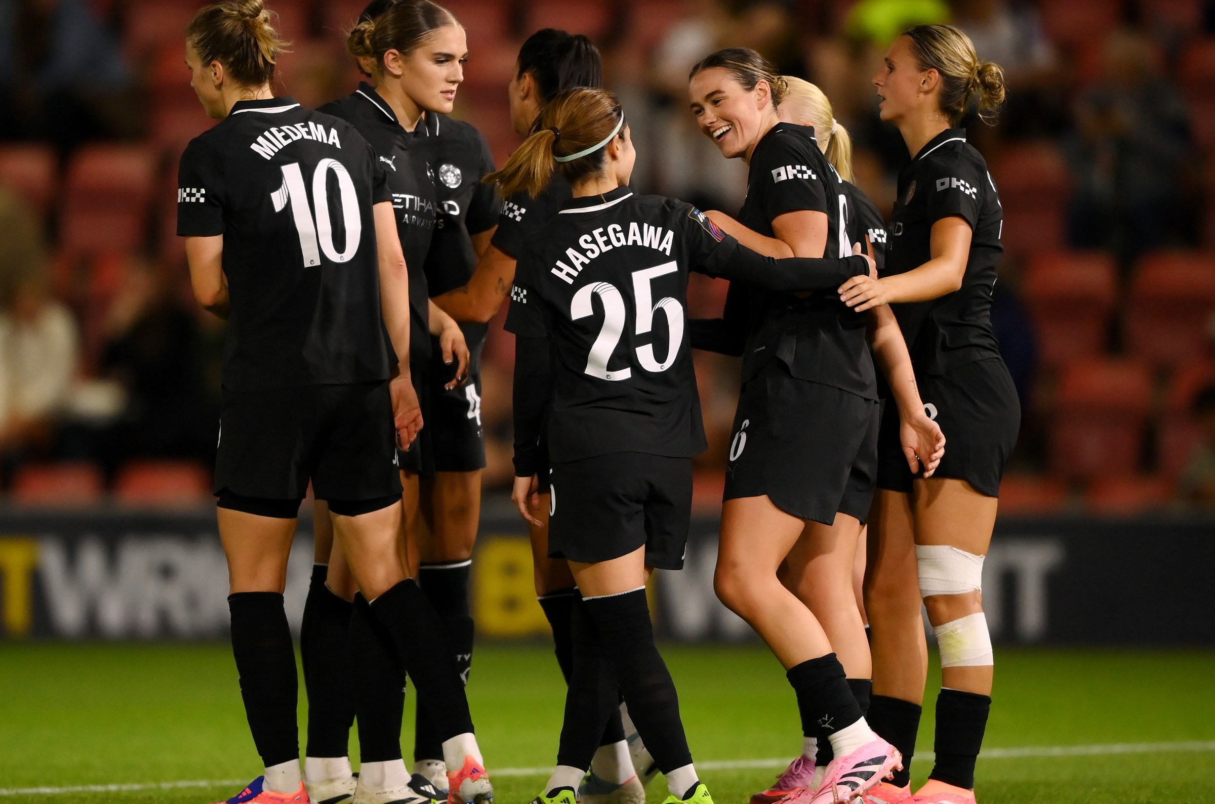 LONDON, ENGLAND - SEPTEMBER 19: Grace Clinton of Manchester City celebrates scoring her team’s fourth goal with Yui Hasegawa during the Barclays Women’s Super League match between Tottenham Hotspur and Manchester City at BetWright Stadium on September 19, 2025 in London, England. (Photo by Harriet Lander - WSL/WSL Football via Getty Images)