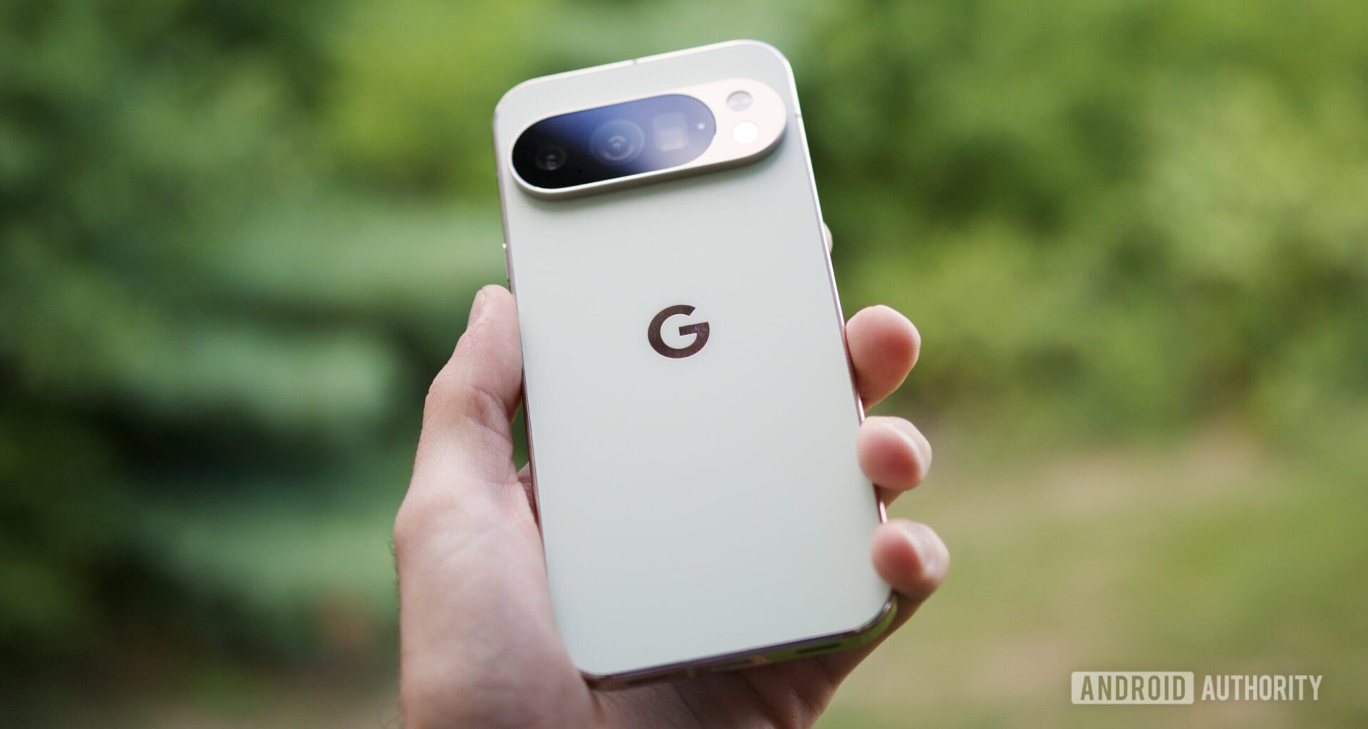 Someone holding the Google Pixel 10 Pro in its Jade color.