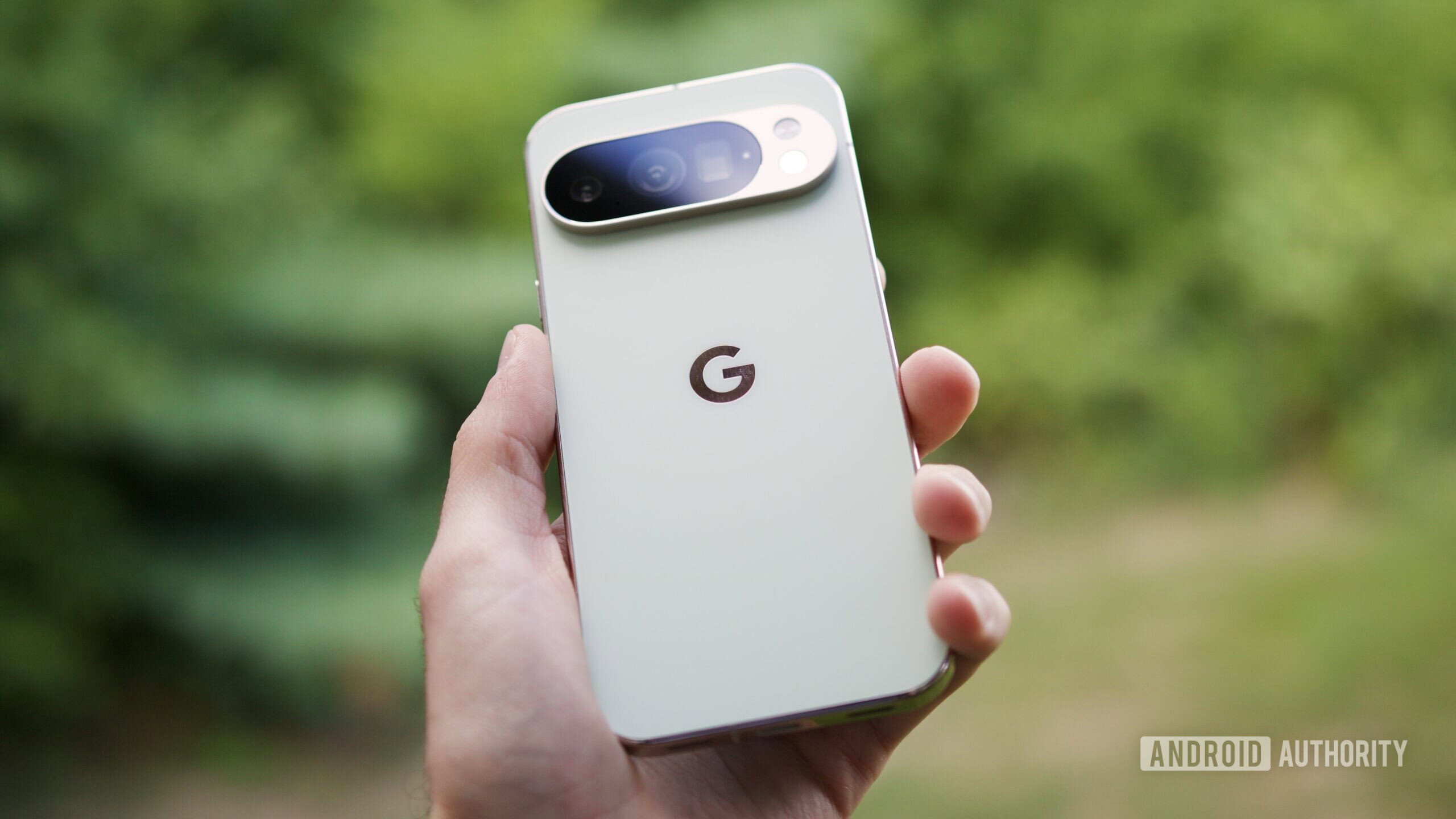 Someone holding the Google Pixel 10 Pro in its Jade color.