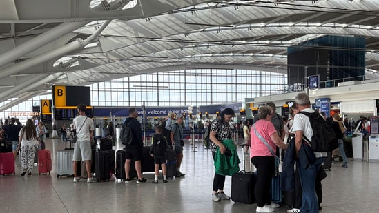 Passengers stand inside T5 at Heathrow airport after an air traffic control (ATC) fault caused major disruption on Wednesday, July 30, 2025.(AP)