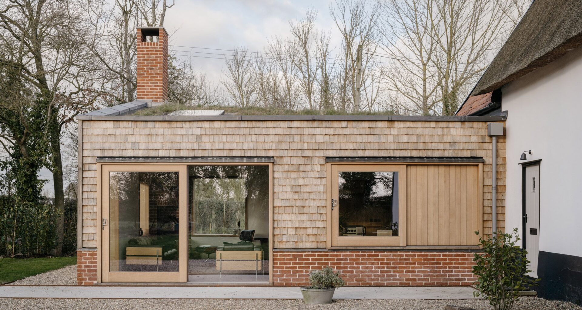 James Grayley Architecture cloaks Church Cottage extension in shingles