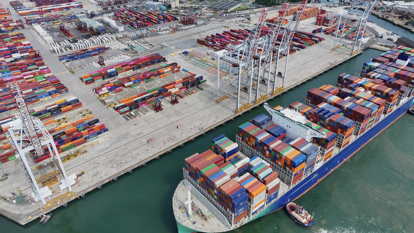 Aerial view of shipping container ship with a full load of colourful containers, Southampton, UK Container Ship Docking