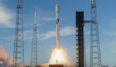 a white rocket lifts off above a plume of fire and smoke
