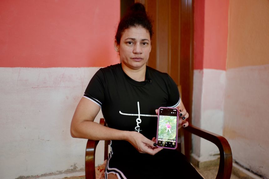 Yudierquis Reyes Merino at a relative's house in central Cuba with a photo of her two-year-old daughter. Reyes was deported to Cuba last week without her daughter after she says US immigration agents told her that her daughter as a US citizen could not be sent to Cuba.