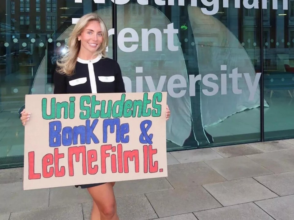 Woman holding sign asking university students to bonk her and let her film it.