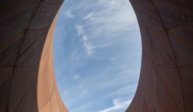 escalators leading up from a contemporary train station in Naples designed by Anish Kapoor