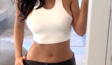 Kylie Jenner Showcases Her Tanned Abs in White Crop Top